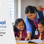 Teacher guiding two students through book-based learning at SPIS Kalwan